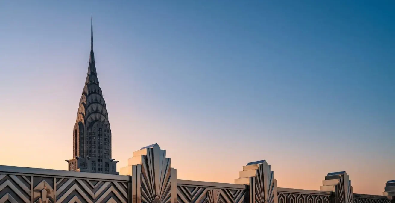 Art deco metallic architectural detail showing geometric patterns and chrome finishes characteristic of 1930s NYC skyscrapers